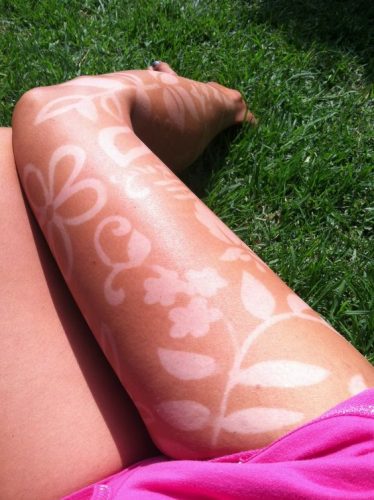 15 Creative Tan Tattoo Ideas for 2025: Embrace the Sun with Stylish Skin Art