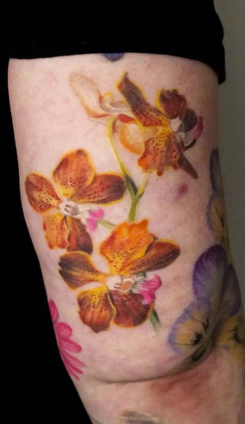 26 Orchid Tattoo Ideas 2025 for Minimalist, Colour, and Fine Line Designs