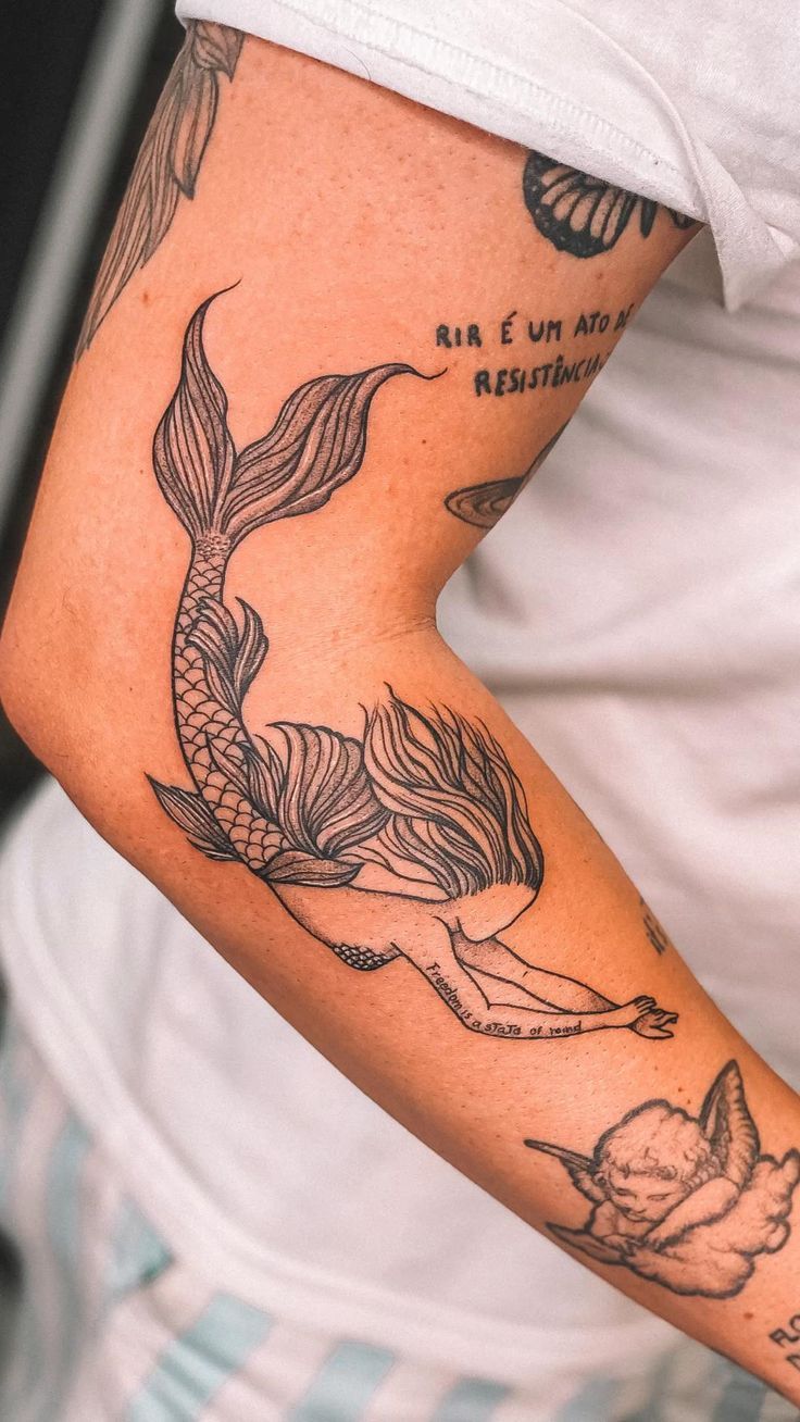 27 Mermaid Tattoo Ideas 2025 With Minimalist, Traditional, Afro, Siren, and Barbie-Inspired Designs