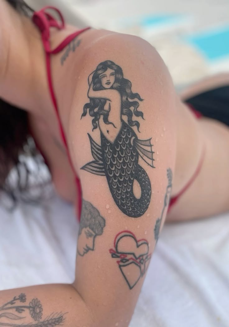 27 Mermaid Tattoo Ideas 2025 With Minimalist, Traditional, Afro, Siren, and Barbie-Inspired Designs