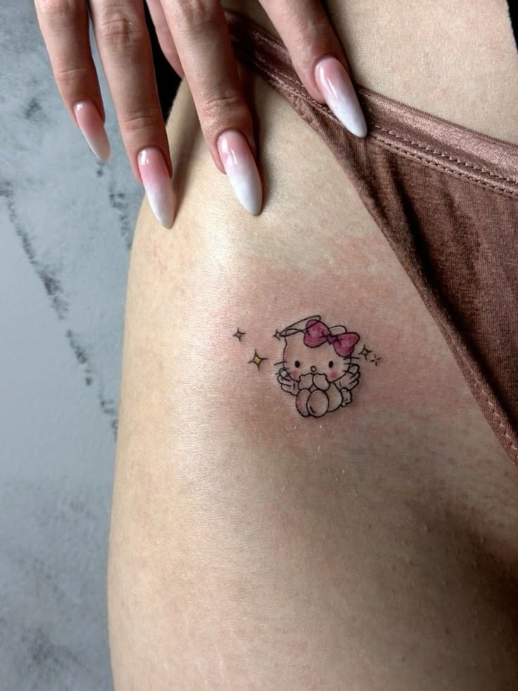 Hello Kitty Tattoo 29 Ideas 2025 for Women, Men &#038; Couples – Sleeve, Fine Line, Y2K, Cien Pies &#038; More