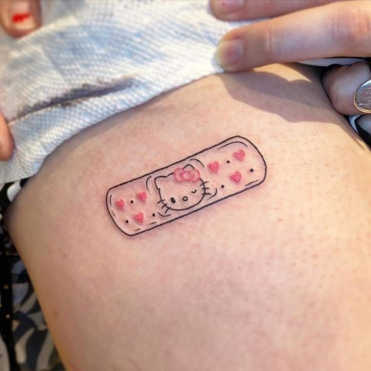 Hello Kitty Tattoo 29 Ideas 2025 for Women, Men &#038; Couples – Sleeve, Fine Line, Y2K, Cien Pies &#038; More