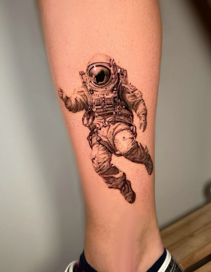 Astronaut Tattoo Ideas for Men and Women – Minimalist, Stencil Outline, and Cosmic Designs