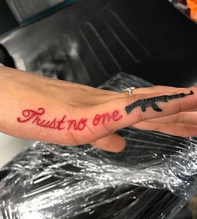 25 Trust No One Tattoo Designs with Lettering, Fonts, Ideas for Men and Women