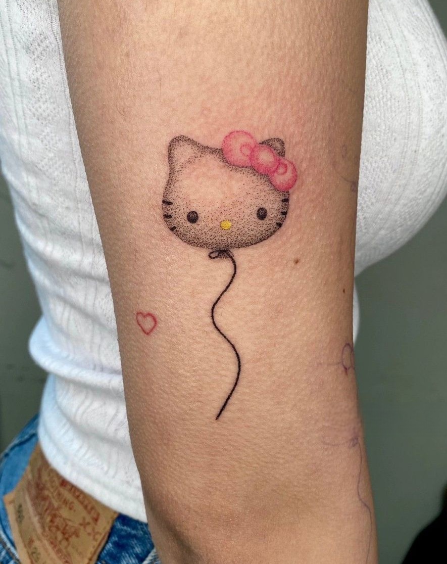 Hello Kitty Tattoo 29 Ideas 2025 for Women, Men &#038; Couples – Sleeve, Fine Line, Y2K, Cien Pies &#038; More