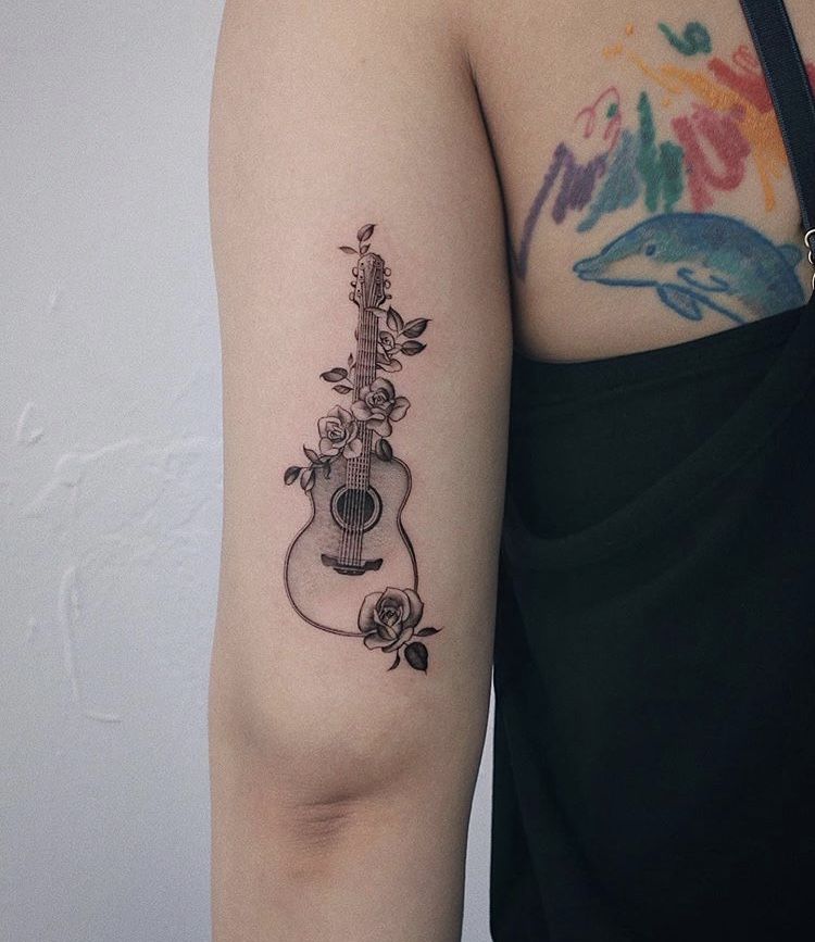 31 Guitar Tattoo Ideas for Music Lovers: From Minimalist Designs to Bold Sleeve Art