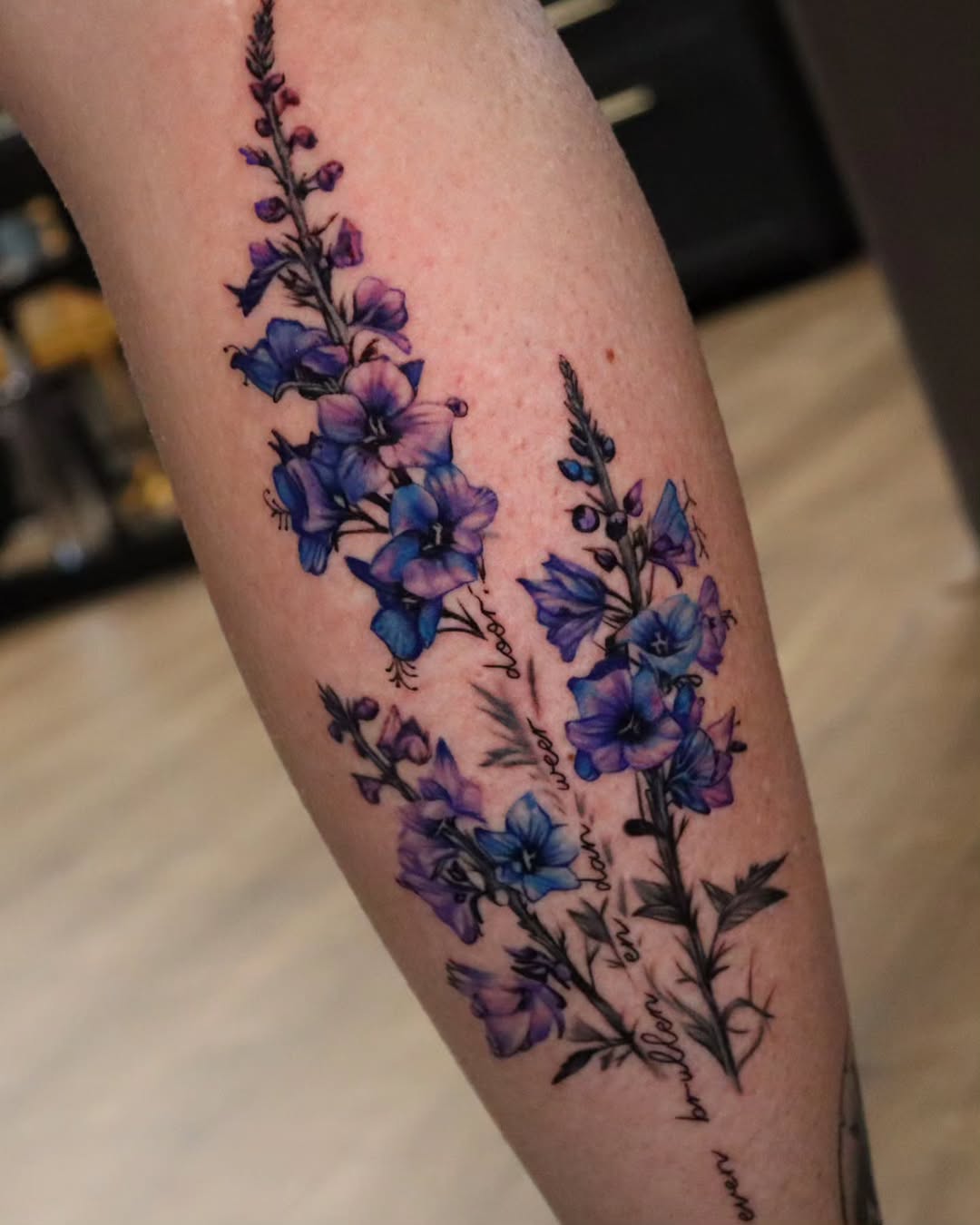 28 Larkspur Tattoo Ideas: Delicate July Blooms with Big Meaning