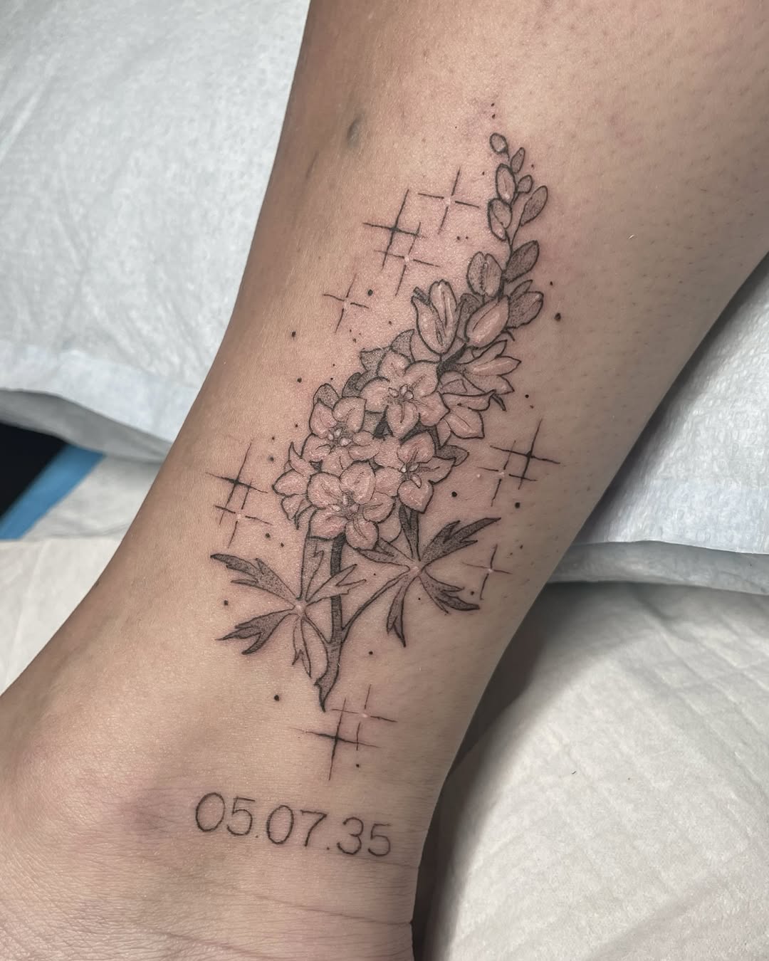 28 Larkspur Tattoo Ideas: Delicate July Blooms with Big Meaning
