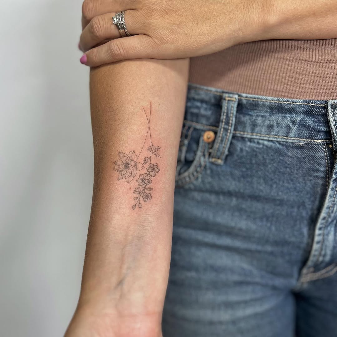 28 Larkspur Tattoo Ideas: Delicate July Blooms with Big Meaning