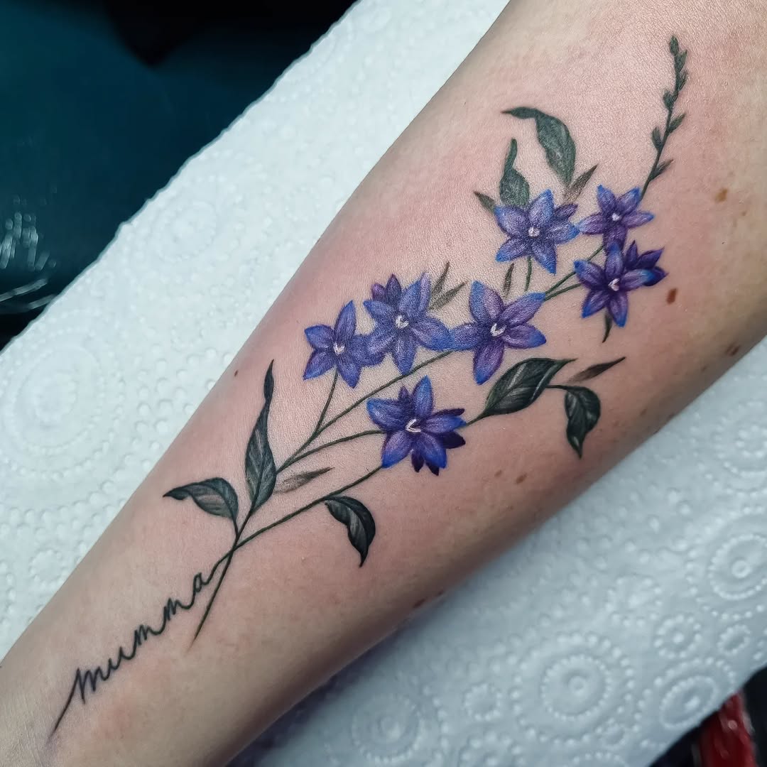28 Larkspur Tattoo Ideas: Delicate July Blooms with Big Meaning