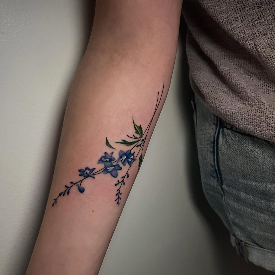 28 Larkspur Tattoo Ideas: Delicate July Blooms with Big Meaning