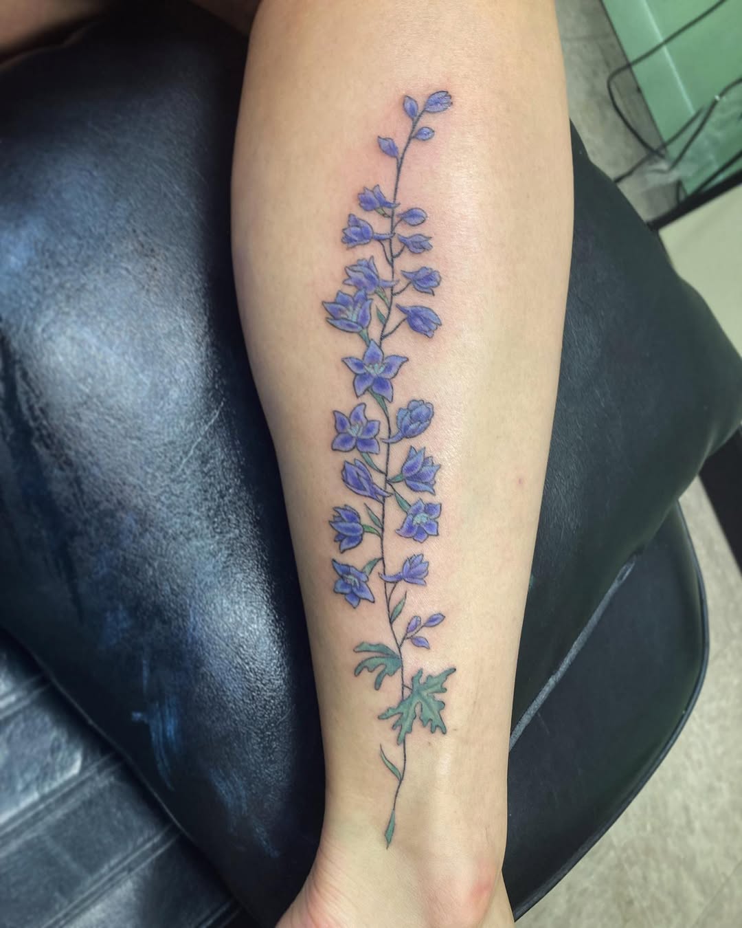 28 Larkspur Tattoo Ideas: Delicate July Blooms with Big Meaning