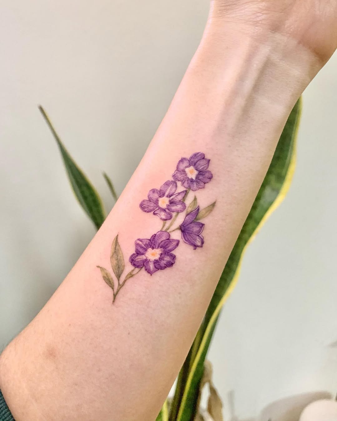 28 Larkspur Tattoo Ideas: Delicate July Blooms with Big Meaning