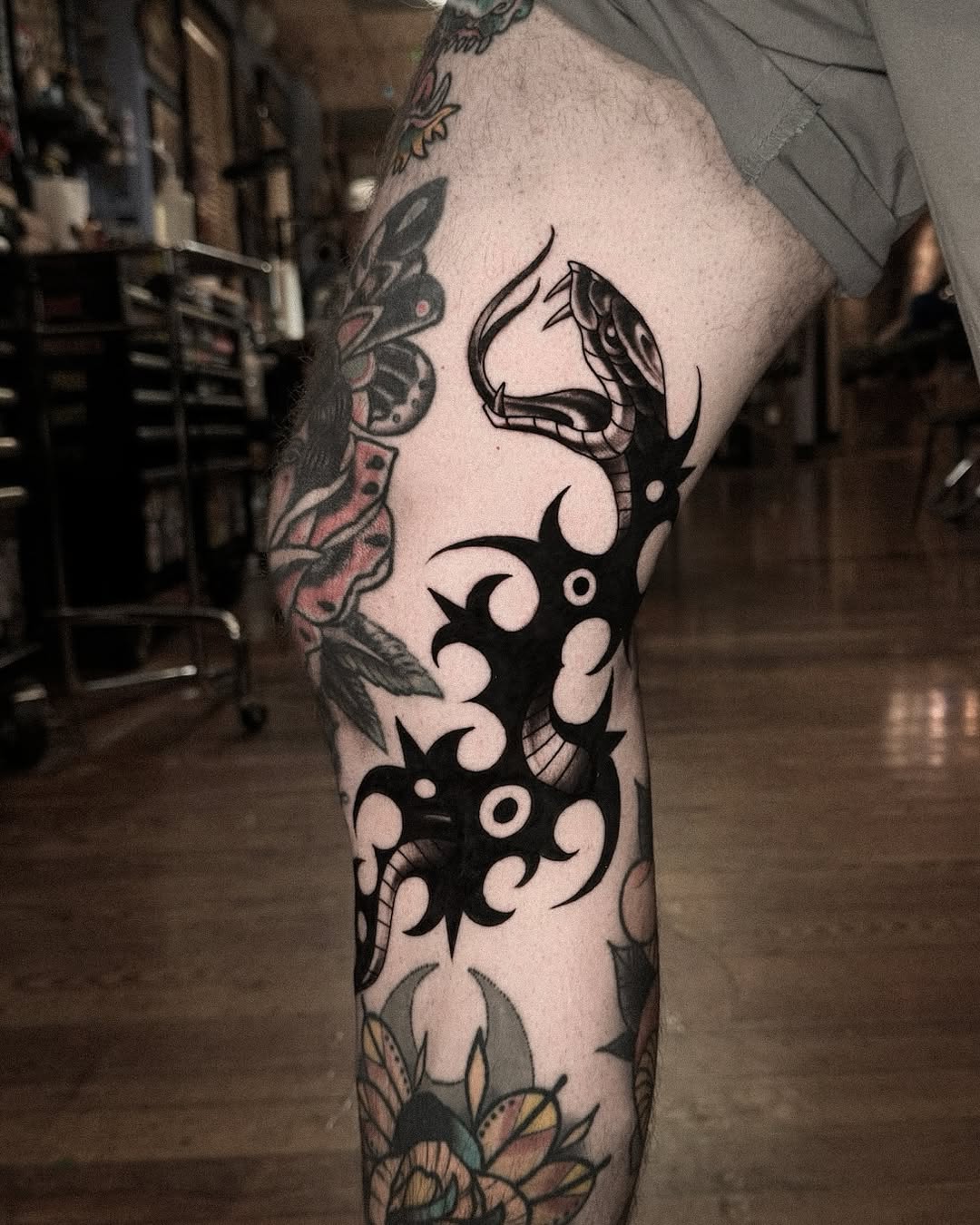 29 Filler Tattoo Ideas: Smart Ways to Close Gaps in Your Sleeve with Flowers, Snakes and Symbols