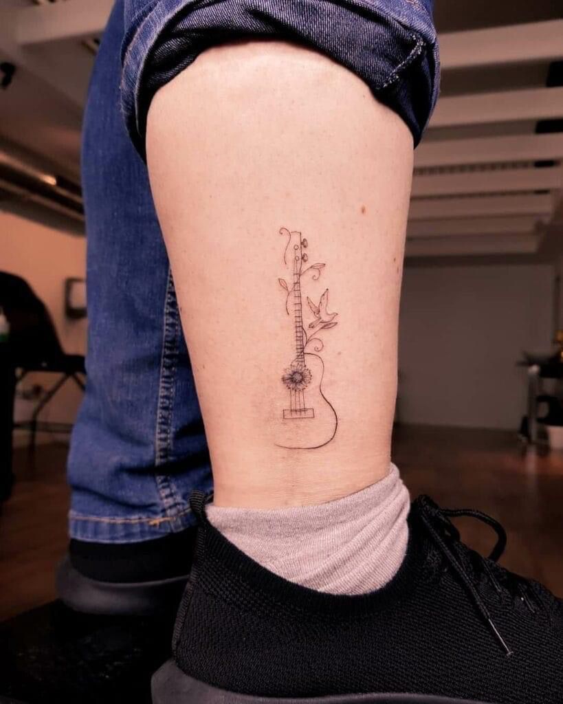 31 Guitar Tattoo Ideas for Music Lovers: From Minimalist Designs to Bold Sleeve Art