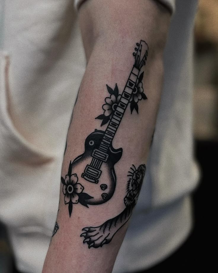 31 Guitar Tattoo Ideas for Music Lovers: From Minimalist Designs to Bold Sleeve Art