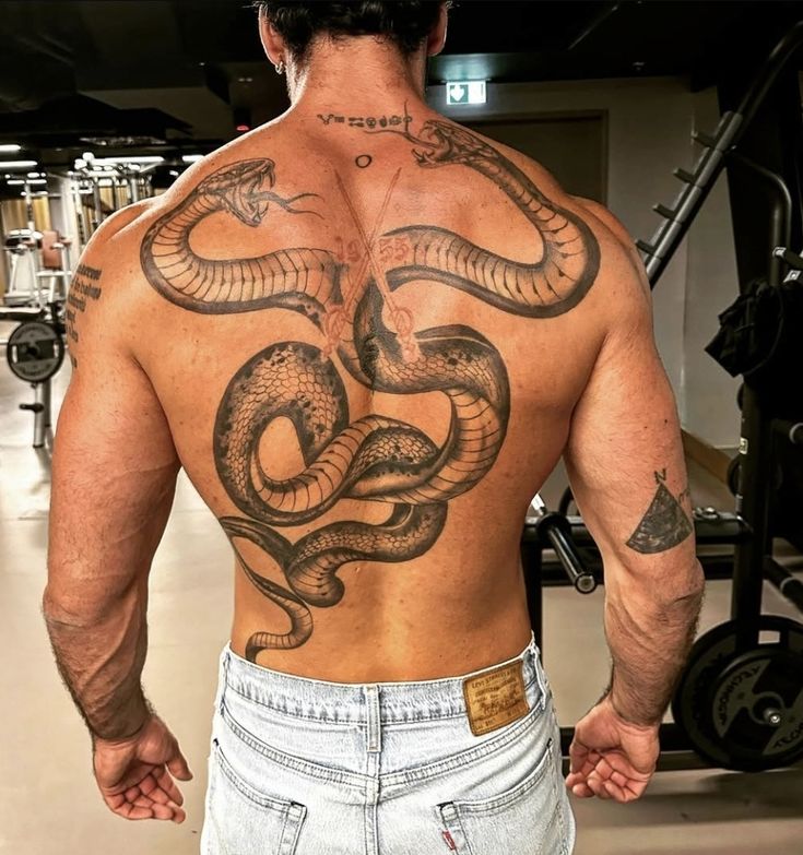 31 Snake Tattoo Ideas 2026: Meaningful Designs for Men and Women on Arm, Back, Spine, and Leg