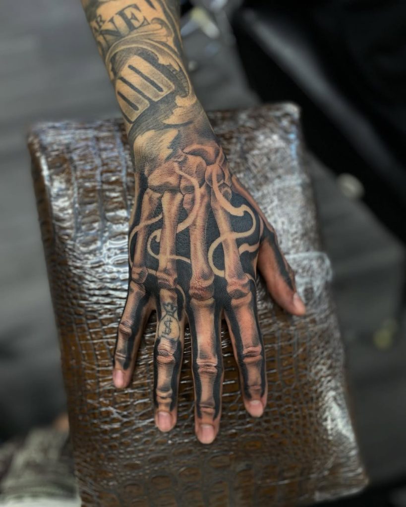 Skeleton Hand Tattoo Ideas 2026 for Men and Women with Roses, Clocks ...