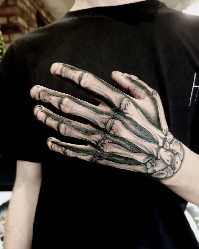Skeleton Hand Tattoo Ideas 2026 for Men and Women with Roses, Clocks ...