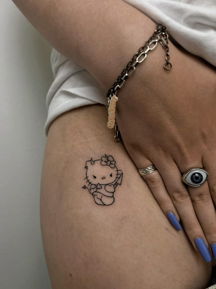 29 Hello Kitty Tattoo Ideas: Cute, Minimalist, Pink and Playful Designs