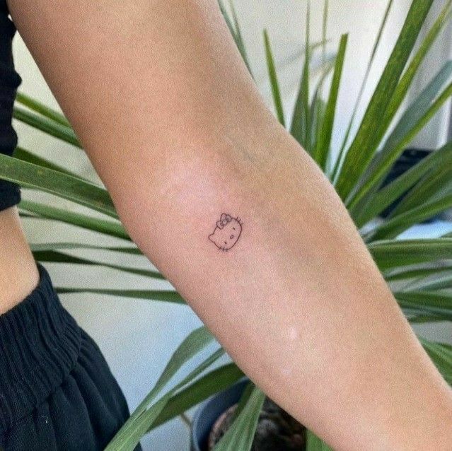 29 Hello Kitty Tattoo Ideas: Cute, Minimalist, Pink and Playful Designs