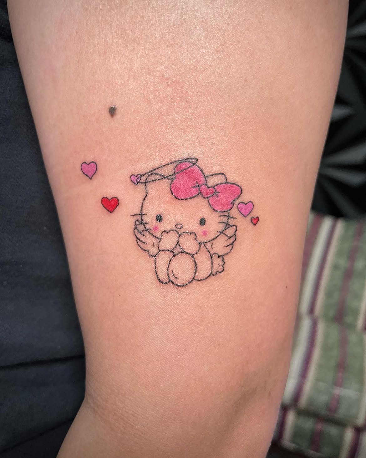 29 Hello Kitty Tattoo Ideas: Cute, Minimalist, Pink and Playful Designs