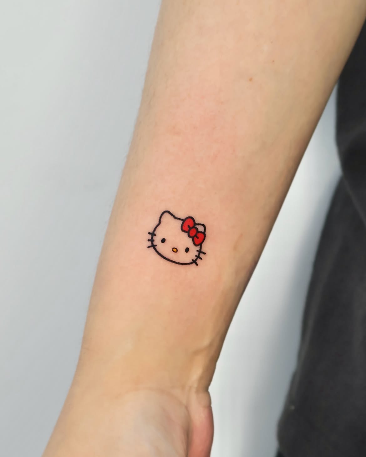 29 Hello Kitty Tattoo Ideas: Cute, Minimalist, Pink and Playful Designs