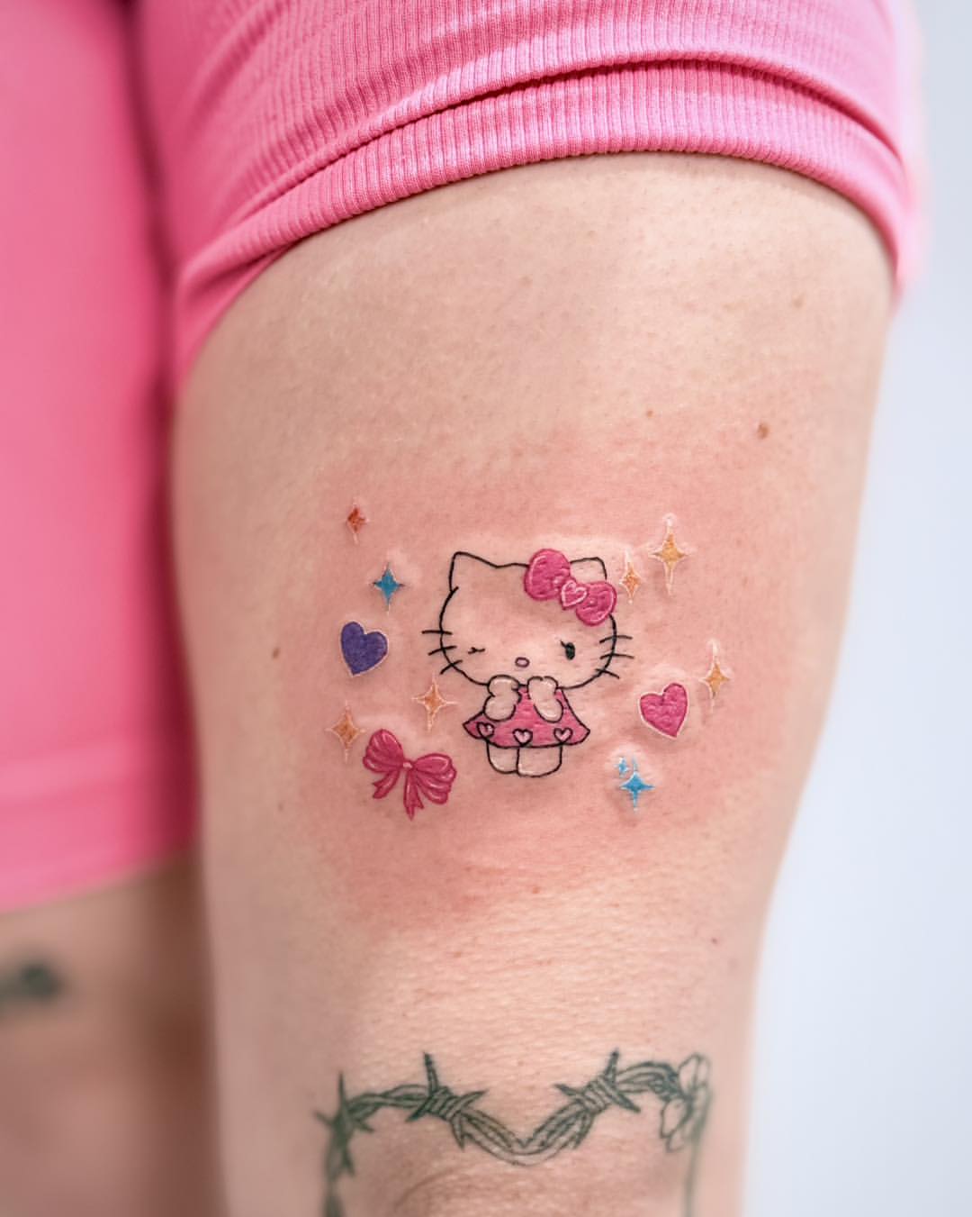 29 Hello Kitty Tattoo Ideas: Cute, Minimalist, Pink and Playful Designs