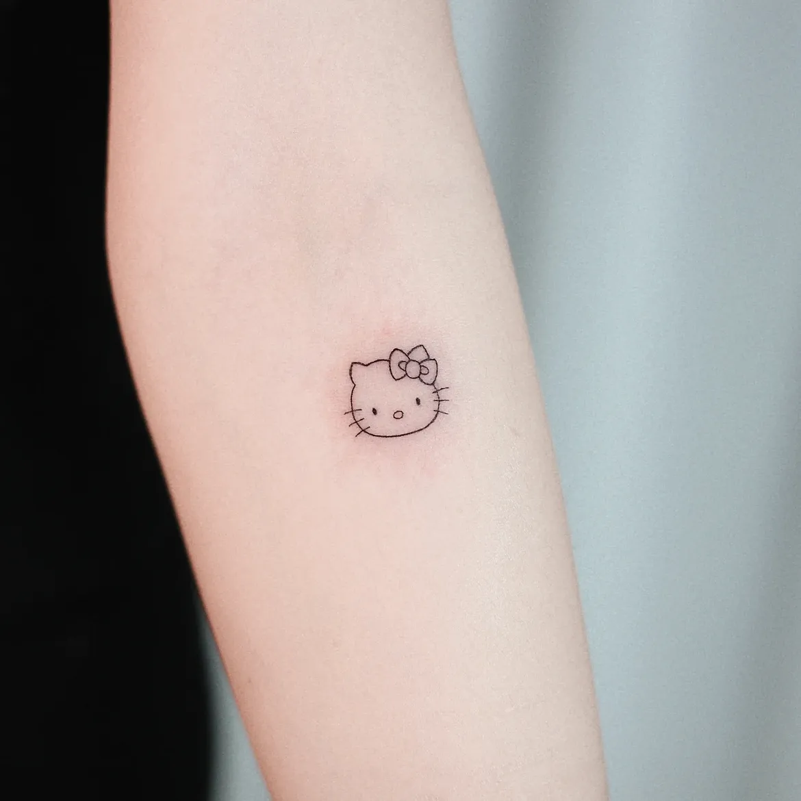 29 Hello Kitty Tattoo Ideas: Cute, Minimalist, Pink and Playful Designs