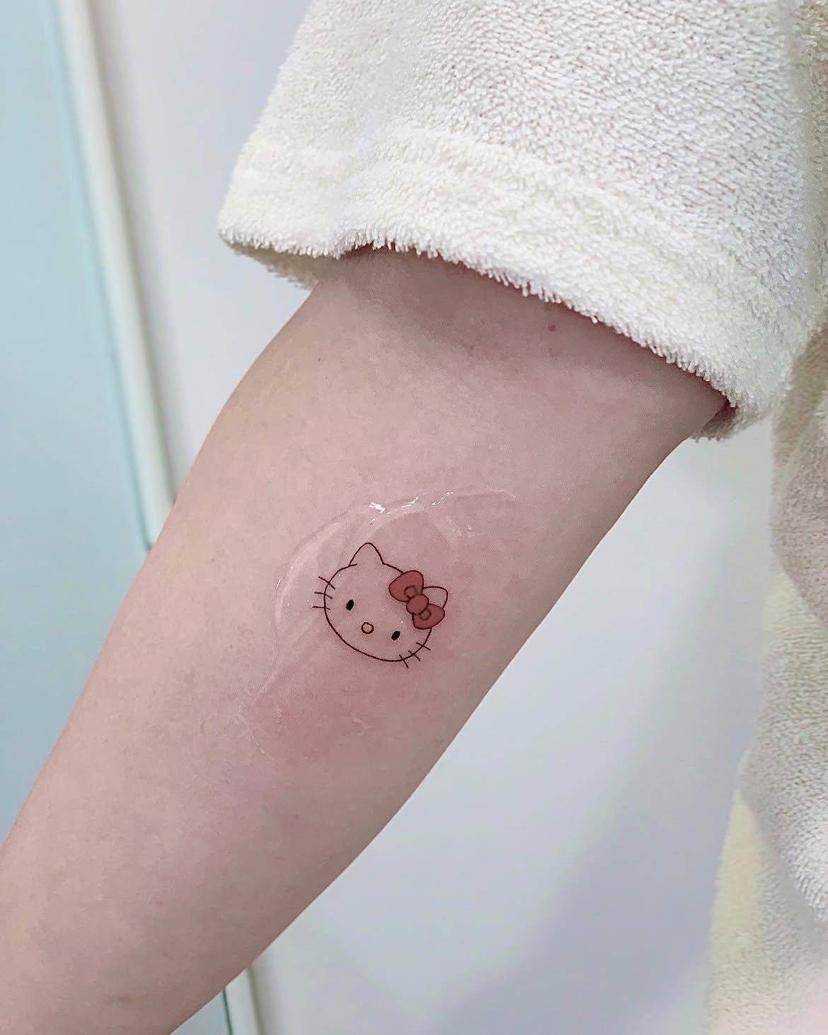29 Hello Kitty Tattoo Ideas: Cute, Minimalist, Pink and Playful Designs