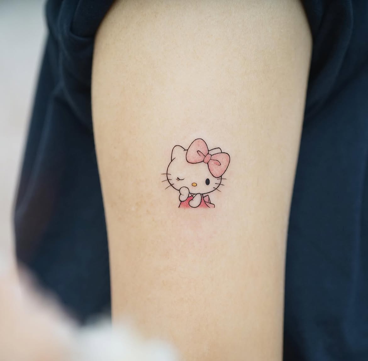 29 Hello Kitty Tattoo Ideas: Cute, Minimalist, Pink and Playful Designs