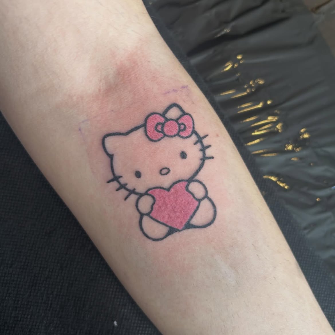 29 Hello Kitty Tattoo Ideas: Cute, Minimalist, Pink and Playful Designs