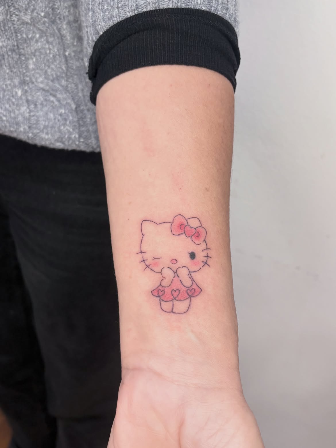 29 Hello Kitty Tattoo Ideas: Cute, Minimalist, Pink and Playful Designs