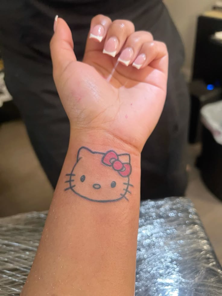 29 Hello Kitty Tattoo Ideas: Cute, Minimalist, Pink and Playful Designs