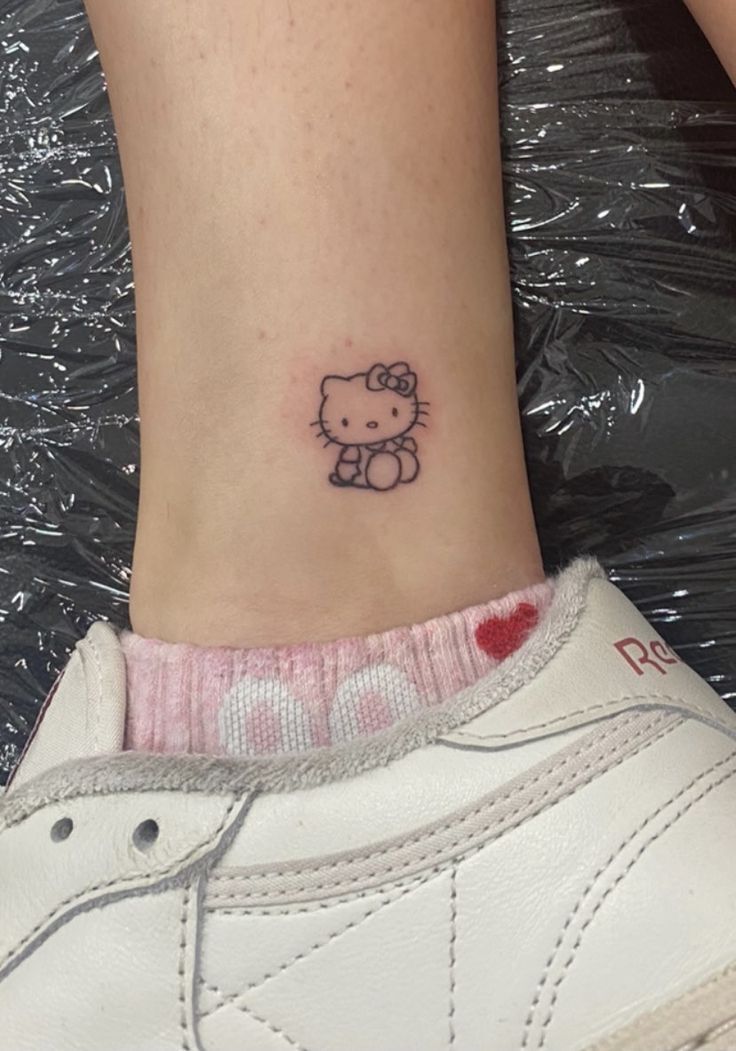 29 Hello Kitty Tattoo Ideas: Cute, Minimalist, Pink and Playful Designs