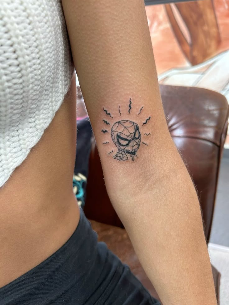 29 Spiderman Tattoo Ideas: From Minimalist Spider Symbols to Dramatic Symbiote Designs
