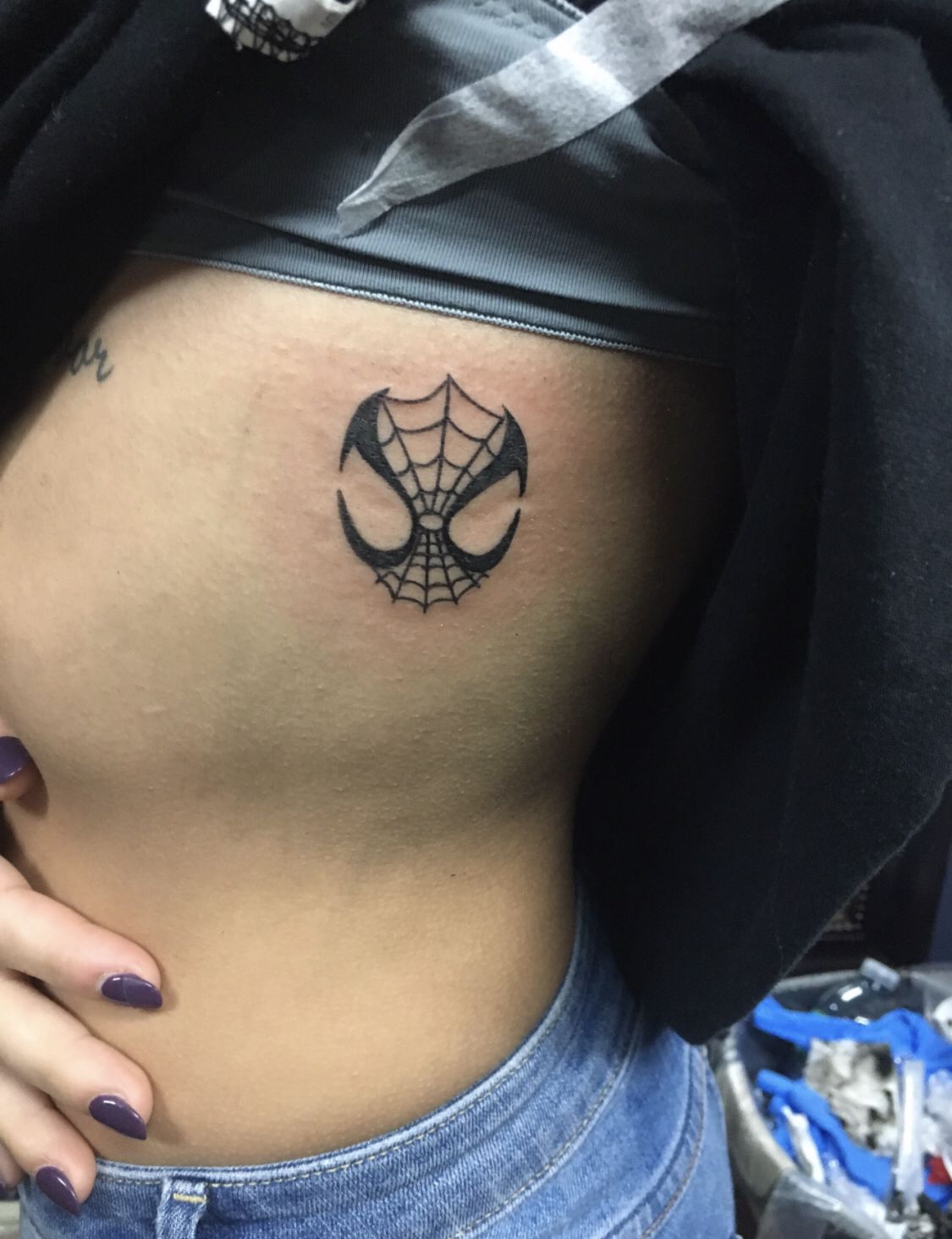 29 Spiderman Tattoo Ideas: From Minimalist Spider Symbols to Dramatic Symbiote Designs