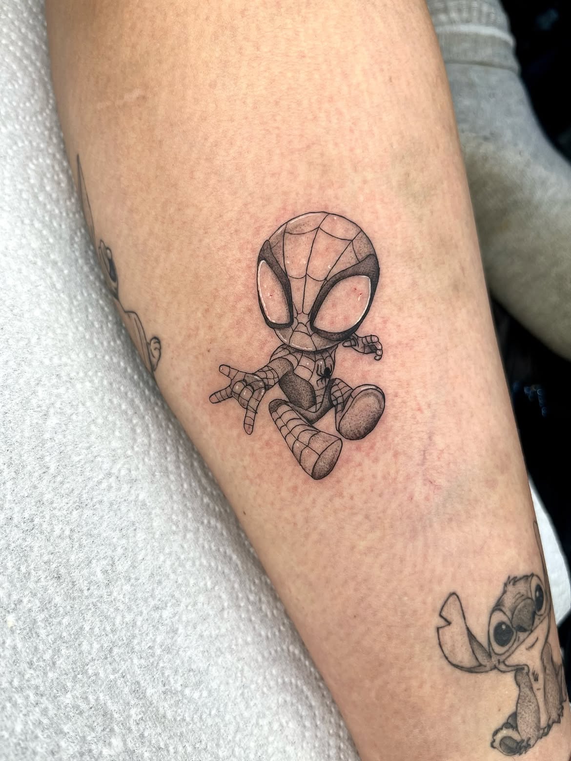 29 Spiderman Tattoo Ideas: From Minimalist Spider Symbols to Dramatic Symbiote Designs