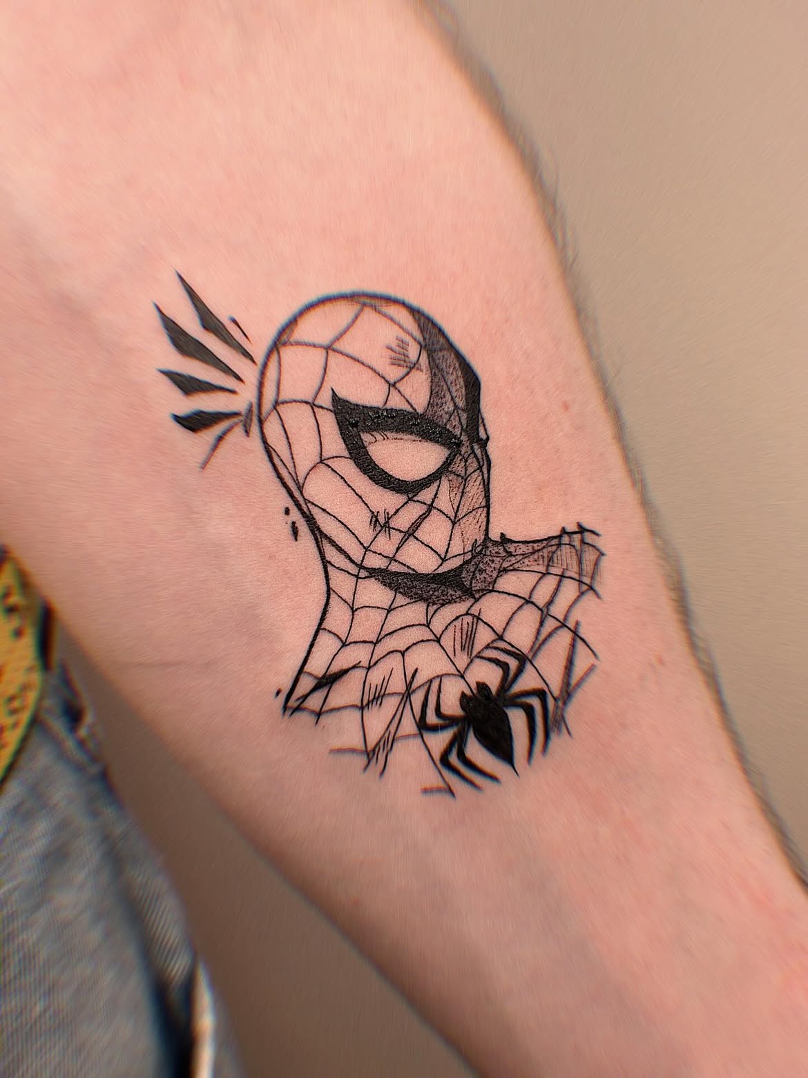 29 Spiderman Tattoo Ideas: From Minimalist Spider Symbols to Dramatic Symbiote Designs