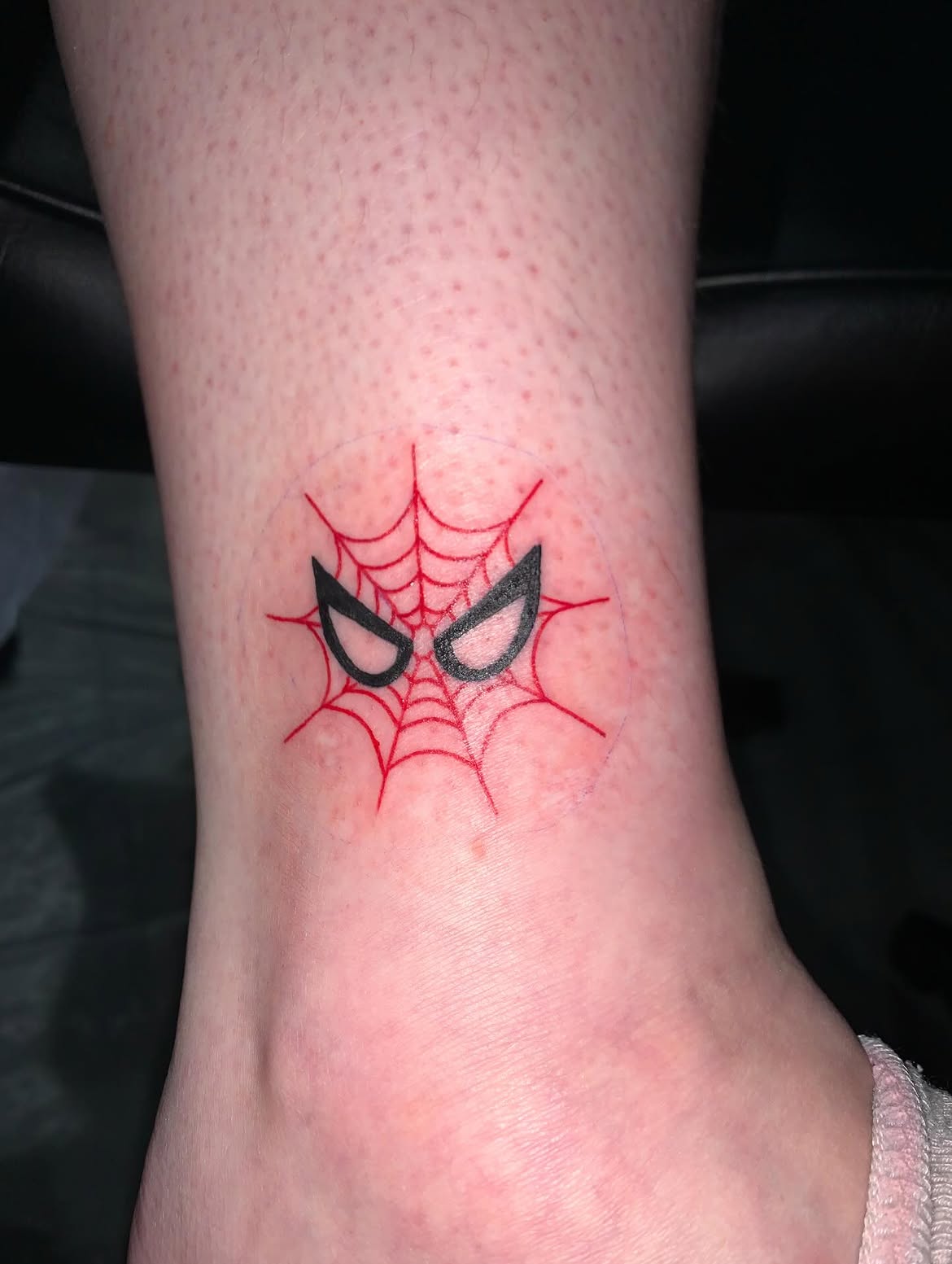 29 Spiderman Tattoo Ideas: From Minimalist Spider Symbols to Dramatic Symbiote Designs