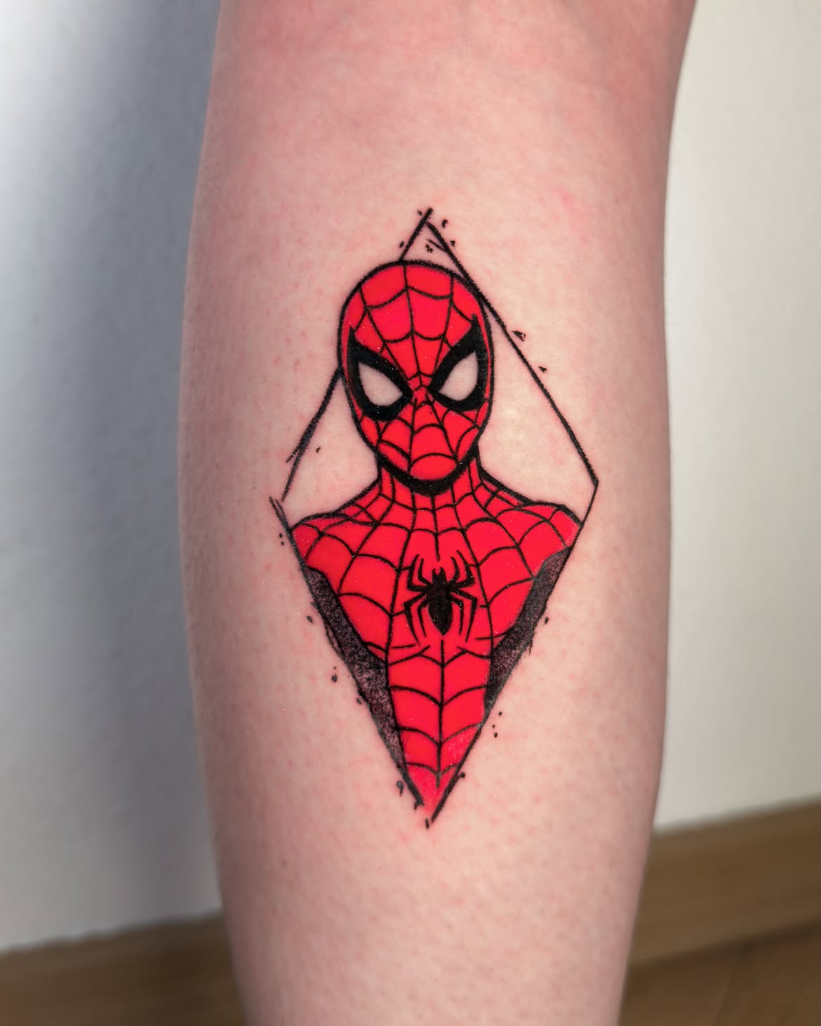 29 Spiderman Tattoo Ideas: From Minimalist Spider Symbols to Dramatic Symbiote Designs