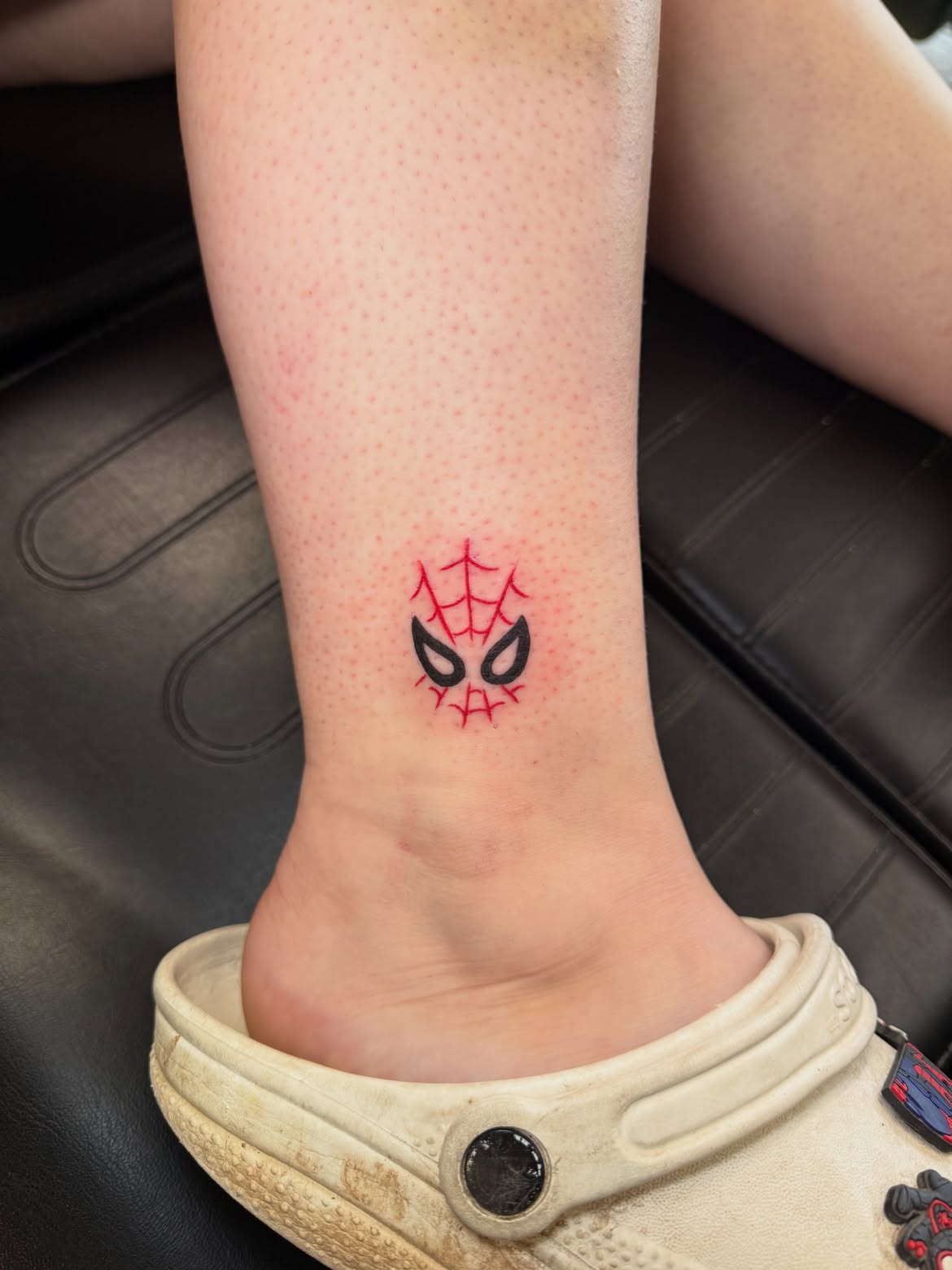 29 Spiderman Tattoo Ideas: From Minimalist Spider Symbols to Dramatic Symbiote Designs