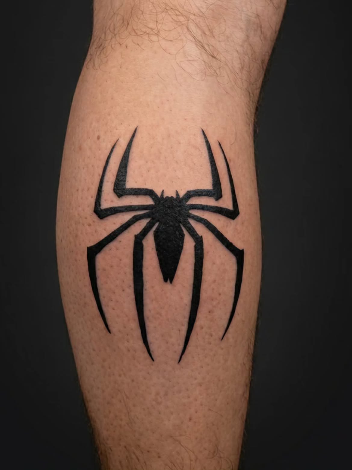 29 Spiderman Tattoo Ideas: From Minimalist Spider Symbols to Dramatic Symbiote Designs