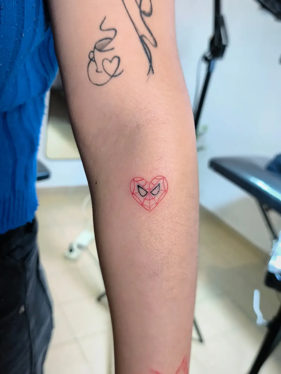 29 Spiderman Tattoo Ideas: From Minimalist Spider Symbols to Dramatic Symbiote Designs