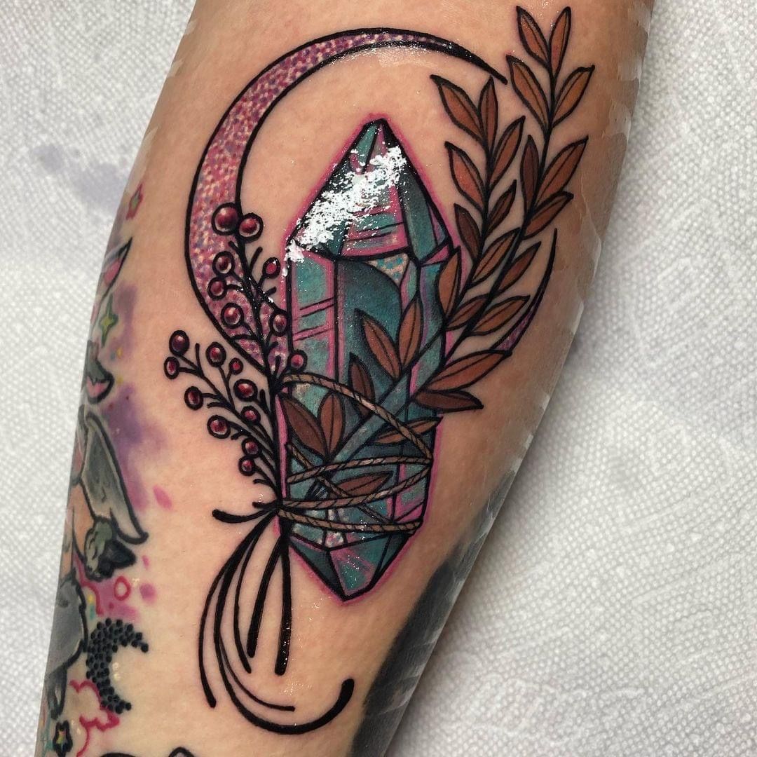 25 Crystal Tattoo Ideas: From Delicate Gemstones to Colorful Botanical Designs