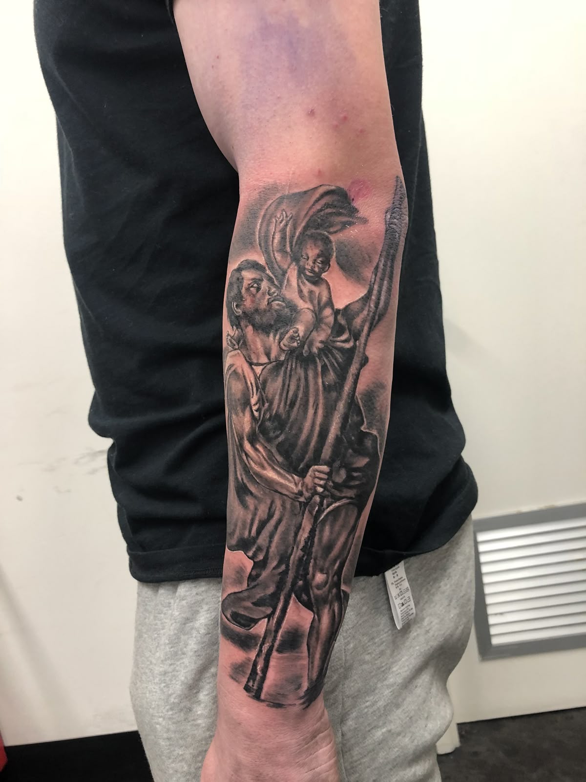 27 Saint Christopher Tattoo Ideas: From Fine Line Protection Symbols to Dramatic Religious Sleeves