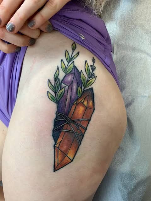 25 Crystal Tattoo Ideas: From Delicate Gemstones to Colorful Botanical Designs