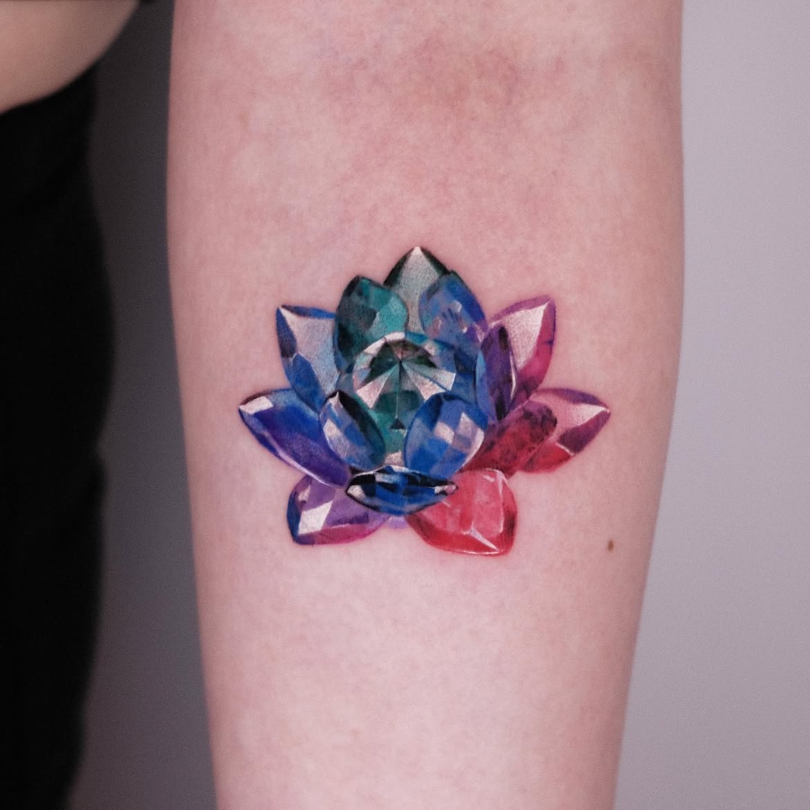 25 Crystal Tattoo Ideas: From Delicate Gemstones to Colorful Botanical Designs