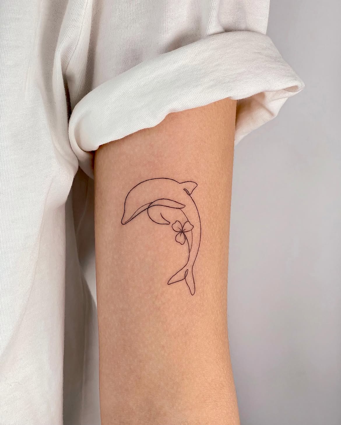 27 Dolphin Tattoo Ideas: Beautiful Designs That Capture Freedom, Joy, and Ocean Magic