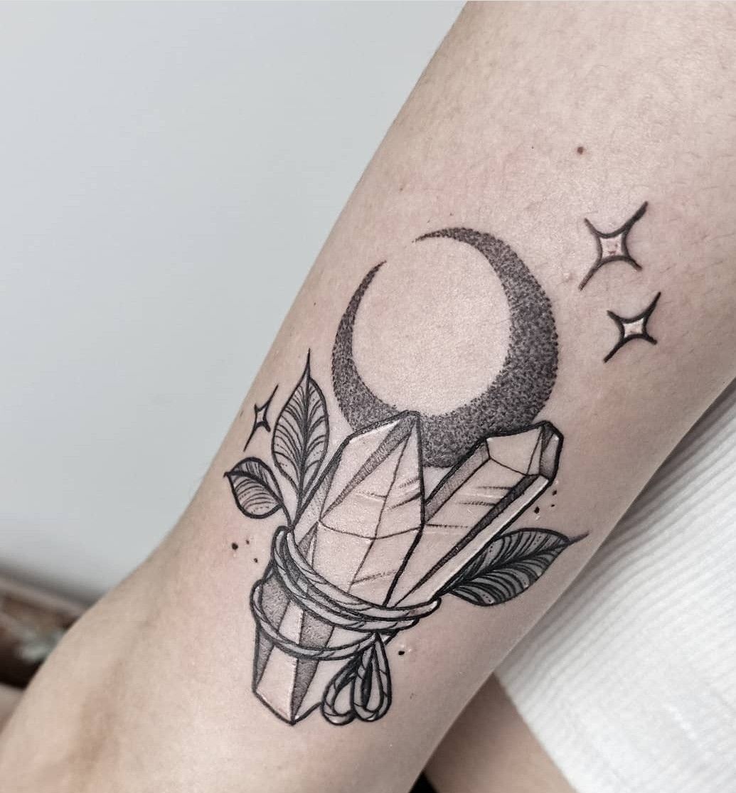 25 Crystal Tattoo Ideas: From Delicate Gemstones to Colorful Botanical Designs